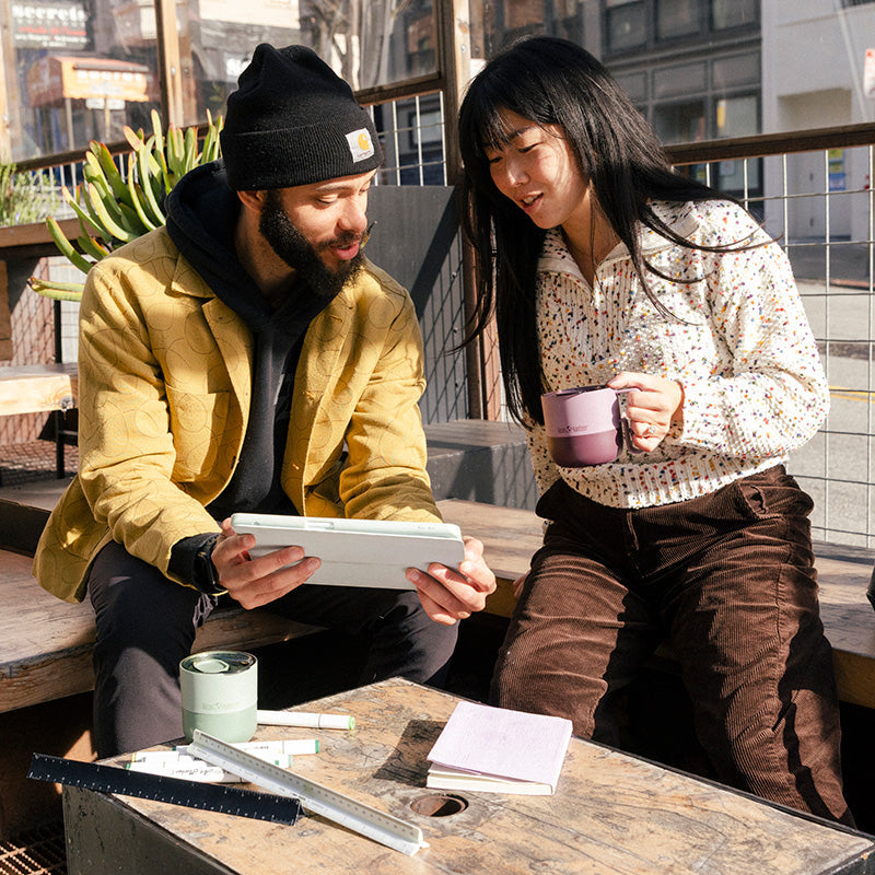 12oz-rise-mug-d0 12oz_rise_coffee_mug_dusty_orchid_couple_city_patio_square.jpg