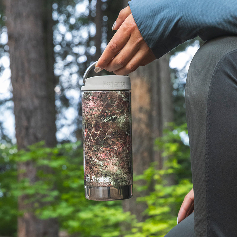 12oz-tkwide-with-twist-cap-mossy-oak-r2 12oz_tumbler_mossyoak_rainbowtrout_hand_closeup_square.jpg