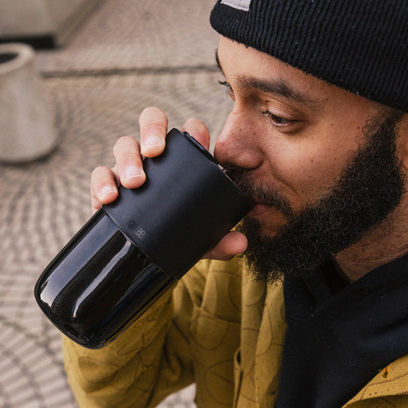 daily-on-the-go-set-t9 16oz_rise_tumbler_black_man_drink_square.jpg