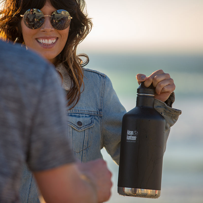 64oz-classic-with-loop-cap-z9 64oz_insulated_classic_black_beach_girl_hand_square.jpg