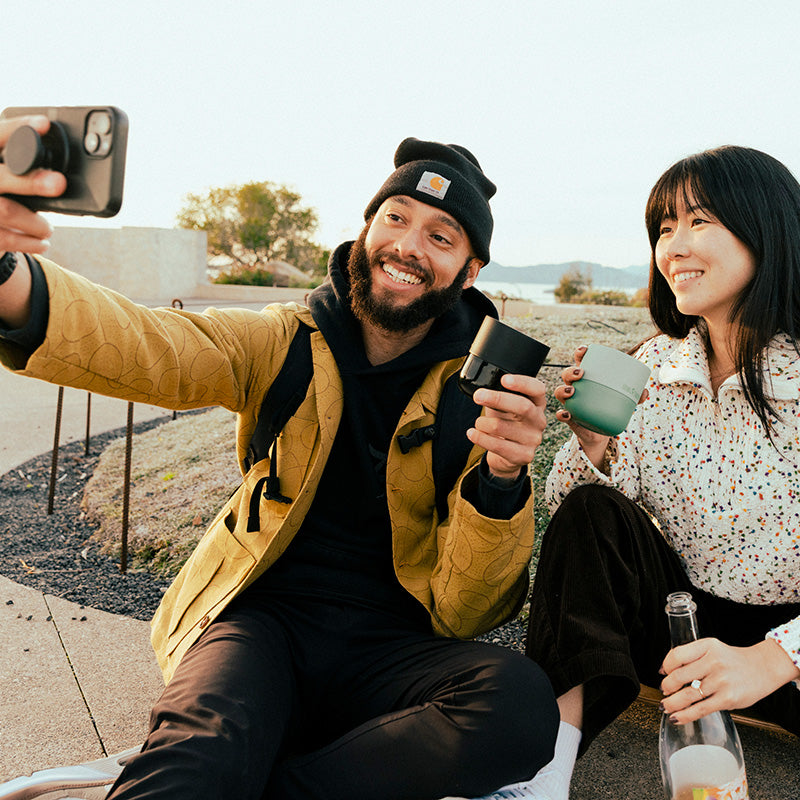 bring-your-own-party-kit-tumblers-and-cocktails-q4 8oz_rise_lowball_black_iceberg_couple_selfie_city_square.jpg