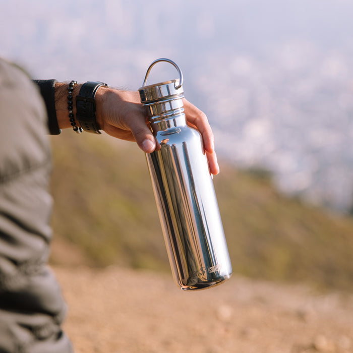 27oz-reflect-with-bamboo-cap-e9 K27SSLRF-MS-BAMBOO_reflect_bottle_hand_lifestyle.jpg